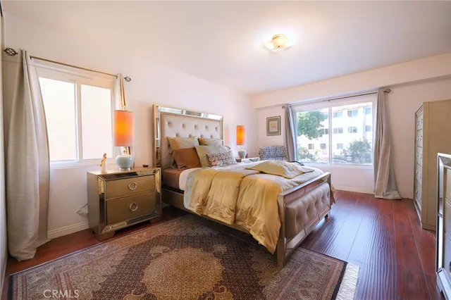 a bed room with a bed and a window