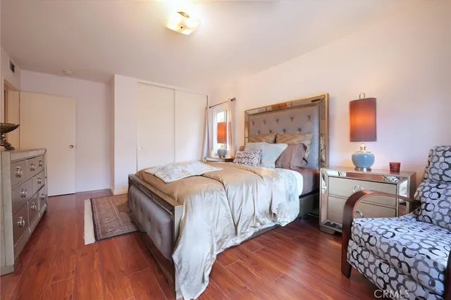 a bedroom with a bed and a couch