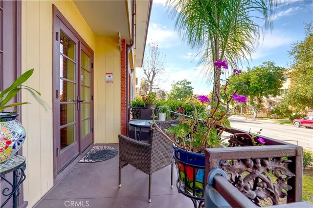 a view of a chairs and table in a patio
