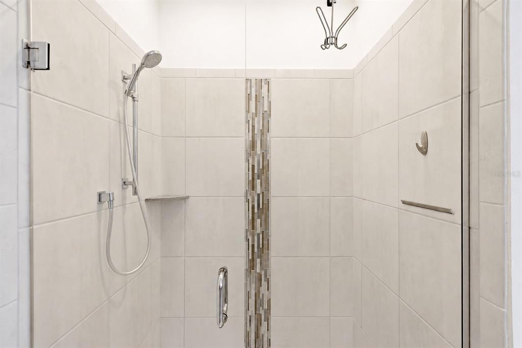 1433 Shira Road Minneola, FL 34715 - Photo 19 of 40 a bathroom with a shower