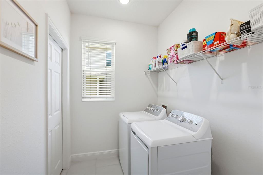 1433 Shira Road Minneola, FL 34715 - Photo 20 of 40 a utility room with dryer and washer