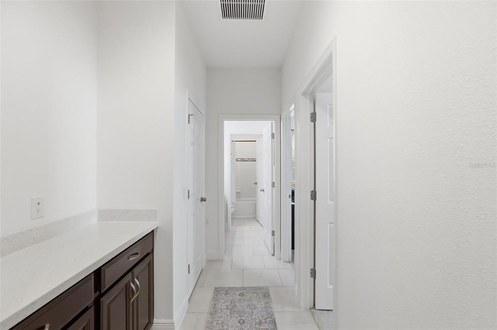 1433 Shira Road Minneola, FL 34715 - Photo 24 of 40 a bathroom with a granite countertop sink and shower