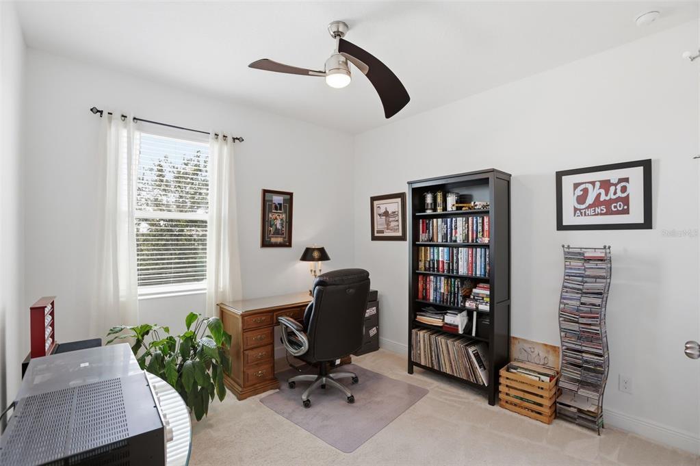 1433 Shira Road Minneola, FL 34715 - Photo 28 of 40 a view of a workspace with furniture and a window