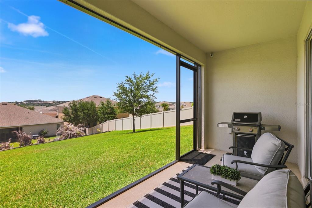 1433 Shira Road Minneola, FL 34715 - Photo 29 of 40 a view of backyard with seating area and green space