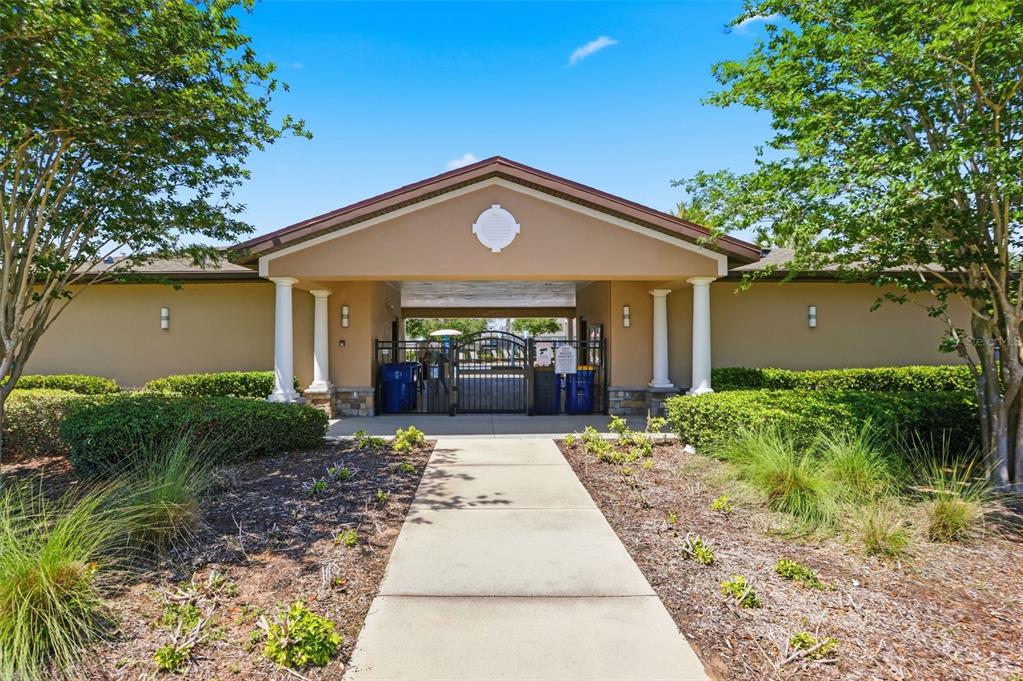 1433 Shira Road Minneola, FL 34715 - Photo 34 of 40 a front view of a house with garden