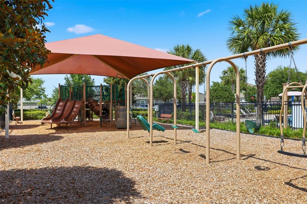 1433 Shira Road Minneola, FL 34715 - Photo 35 of 40 a view of a house with backyard and sitting area
