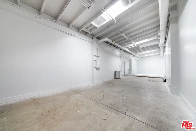 a view of a room with lots of wooden furniture