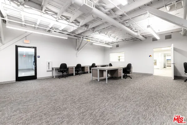 a view of a kitchen with furniture and a window