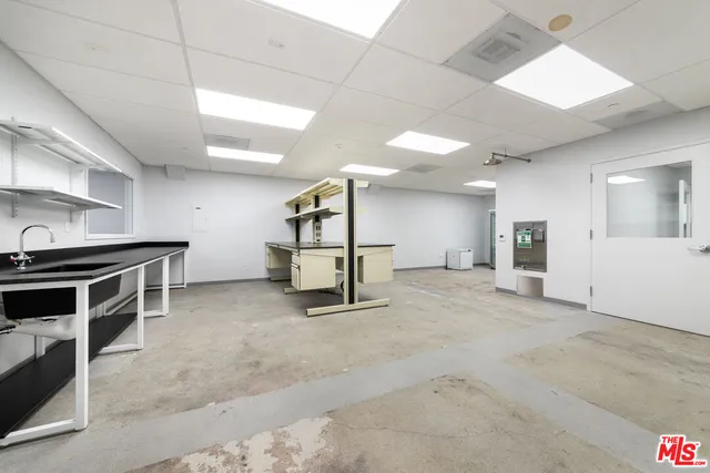a view of work space with furniture and a flat screen tv