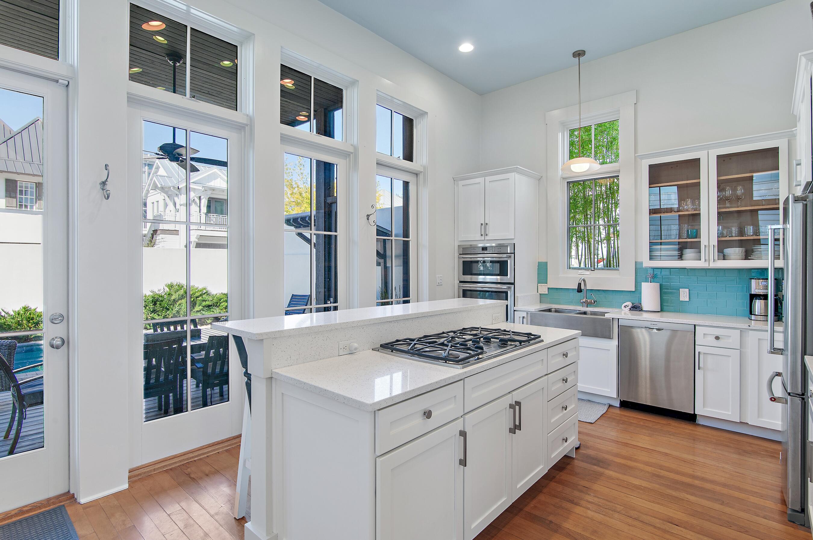 182 Kingston Road Inlet Beach, FL 32461 - Photo 15 of 55 a kitchen with stainless steel appliances granite countertop a stove and a refrigerator