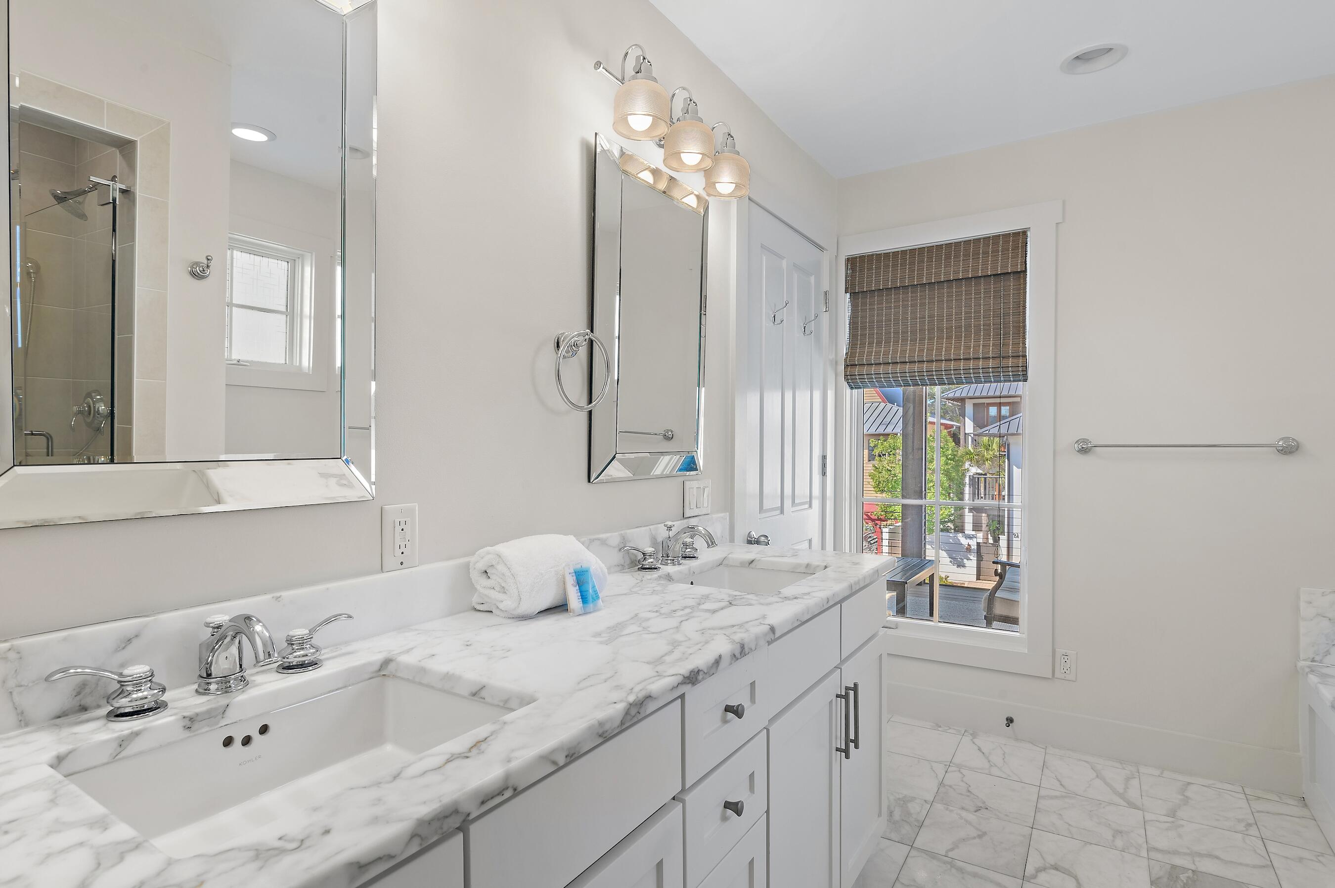 182 Kingston Road Inlet Beach, FL 32461 - Photo 25 of 55 a bathroom with a double vanity sink and a mirror