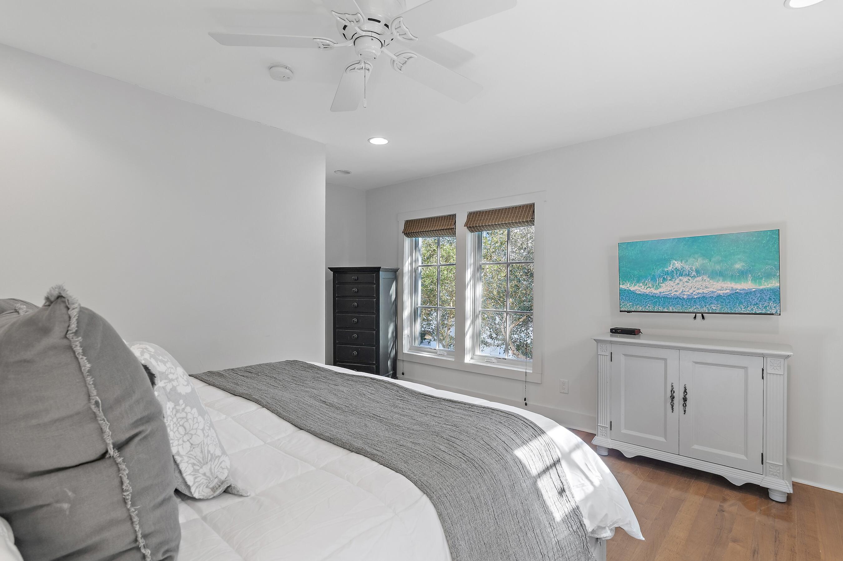 182 Kingston Road Inlet Beach, FL 32461 - Photo 28 of 55 a bedroom with a bed and a flat screen tv