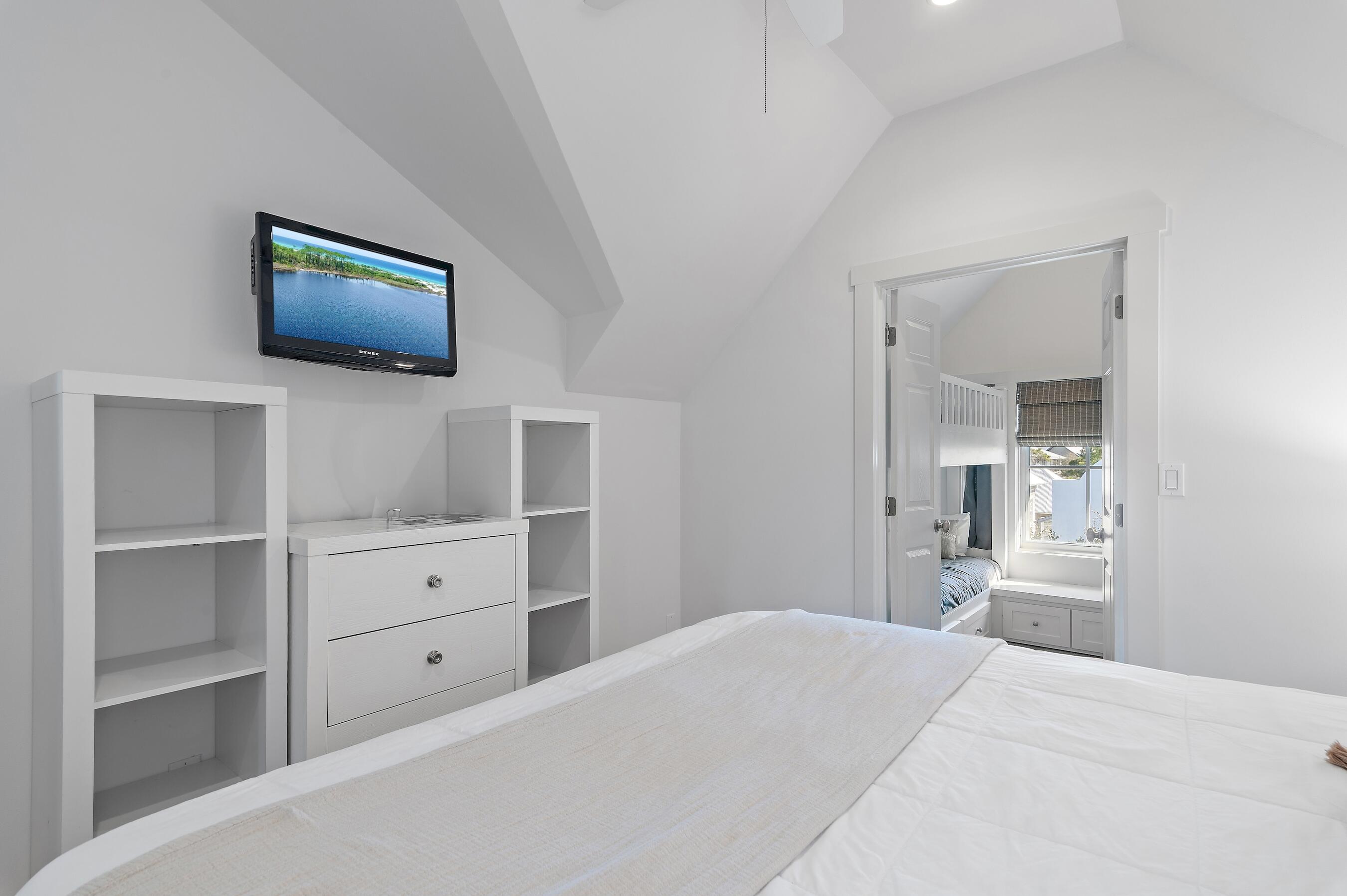 182 Kingston Road Inlet Beach, FL 32461 - Photo 33 of 55 a bedroom with a bed and a flat screen tv