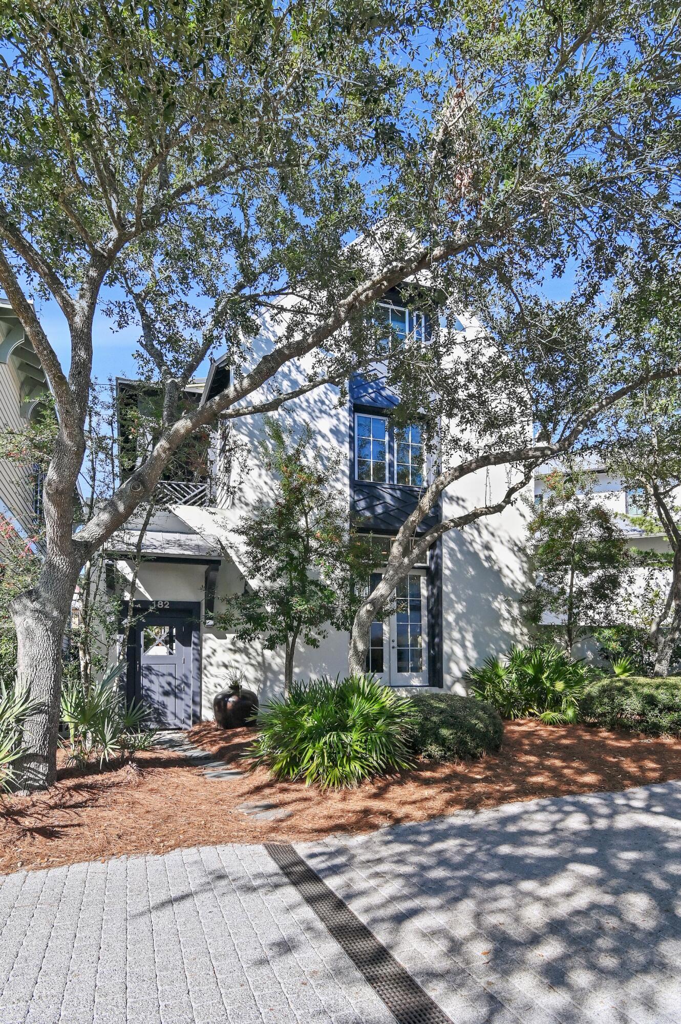182 Kingston Road Inlet Beach, FL 32461 - Photo 34 of 55 a front view of a house with a yard and a garage