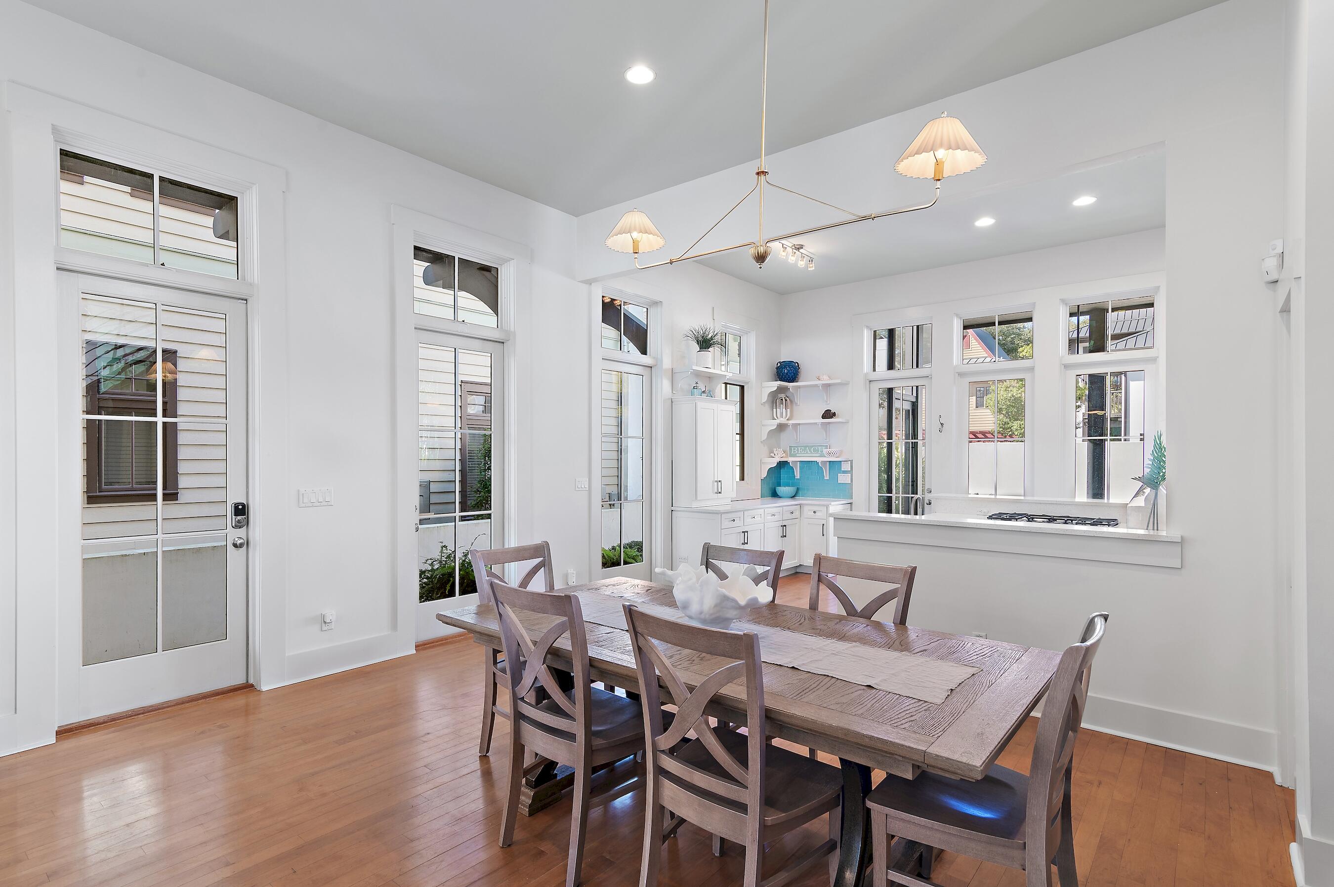 182 Kingston Road Inlet Beach, FL 32461 - Photo 44 of 55 a view of a a dining room with furniture window and wooden floor