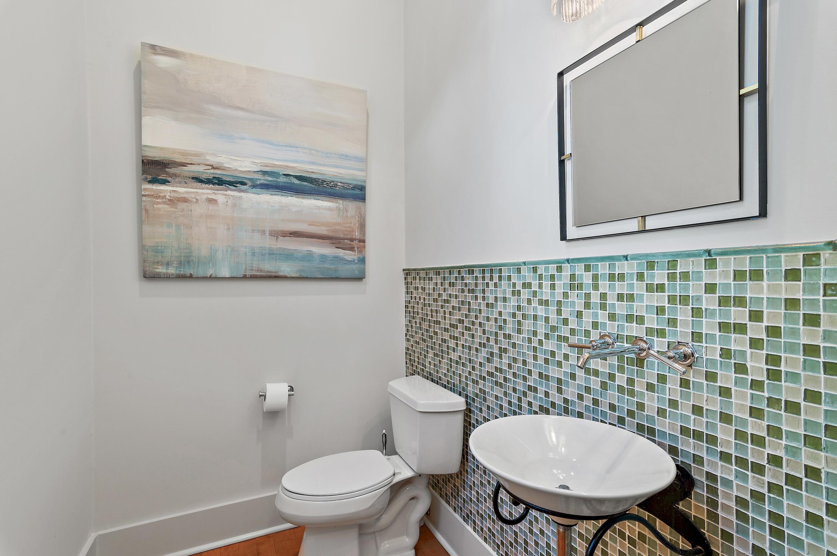 182 Kingston Road Inlet Beach, FL 32461 - Photo 9 of 55 a bathroom with a toilet a sink and a mirror