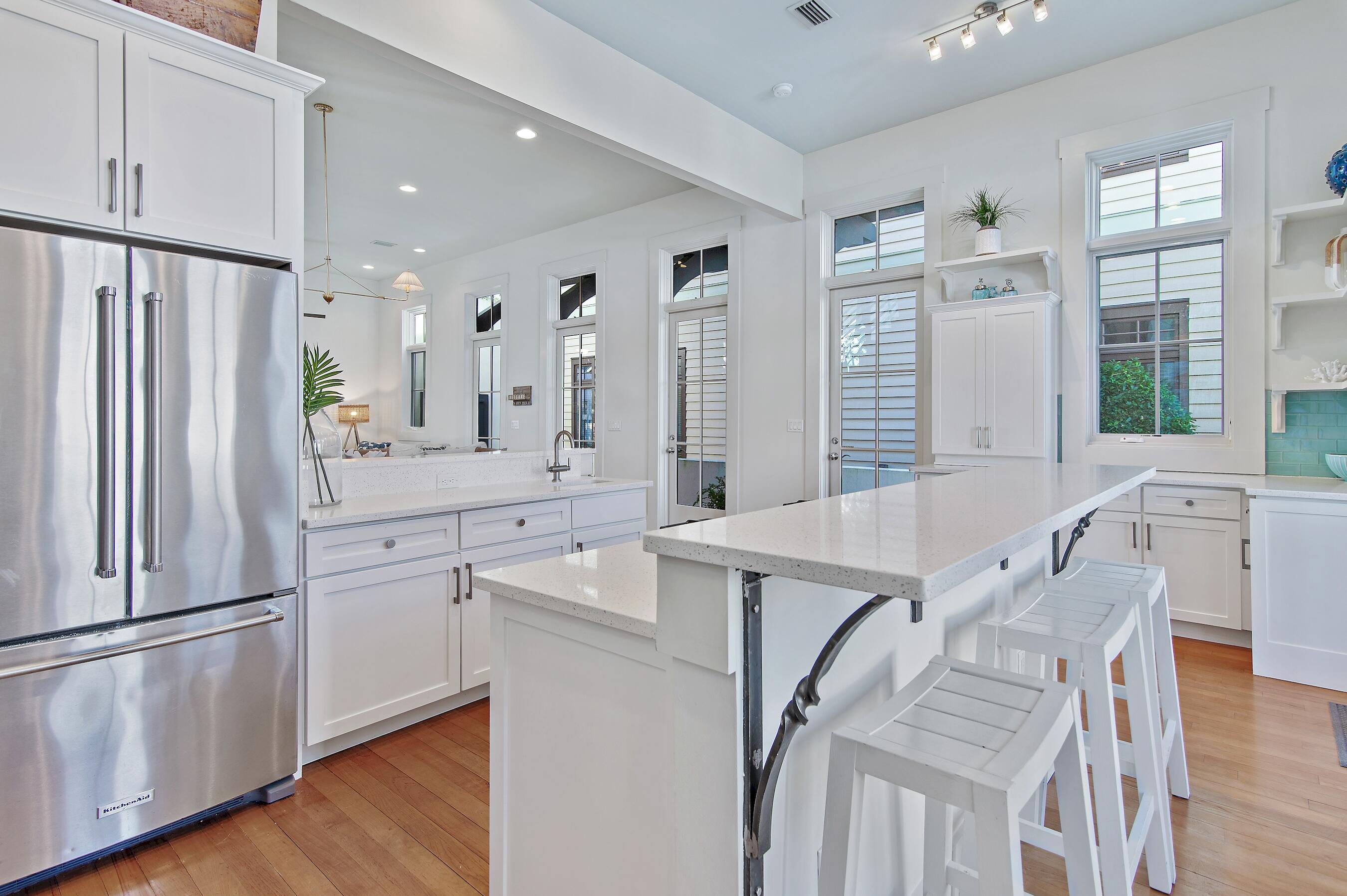 182 Kingston Road Inlet Beach, FL 32461 - Photo 10 of 55 a kitchen with stainless steel appliances a refrigerator and a stove top oven