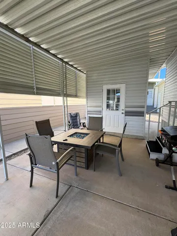 a backyard of a house with outdoor seating