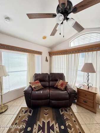 a living room with furniture and a window