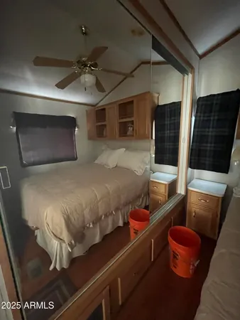 a bedroom with a bed and a couch