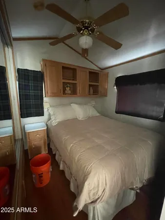 a bedroom with a bed and a television
