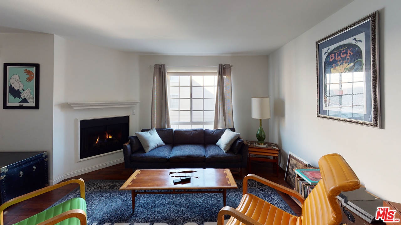 522 West Stocker Street, Unit 7 Glendale, CA 91202 - Photo 11 of 12 a living room with furniture and a fireplace