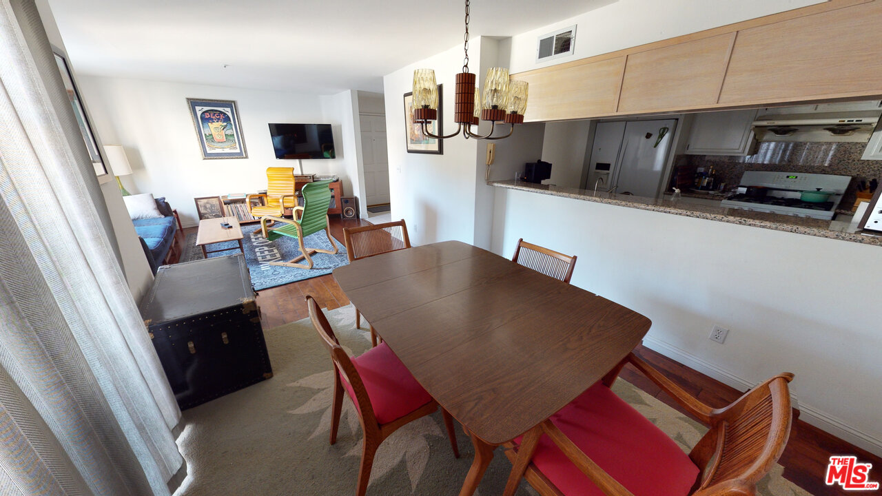 522 West Stocker Street, Unit 7 Glendale, CA 91202 - Photo 3 of 12 a view of a dining room with furniture and wooden floor