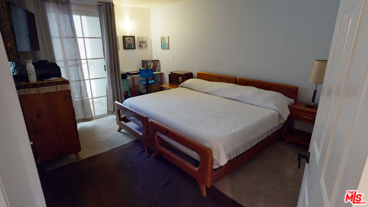 522 West Stocker Street, Unit 7 Glendale, CA 91202 - Photo 5 of 12 a bed sitting in a bedroom next to a window