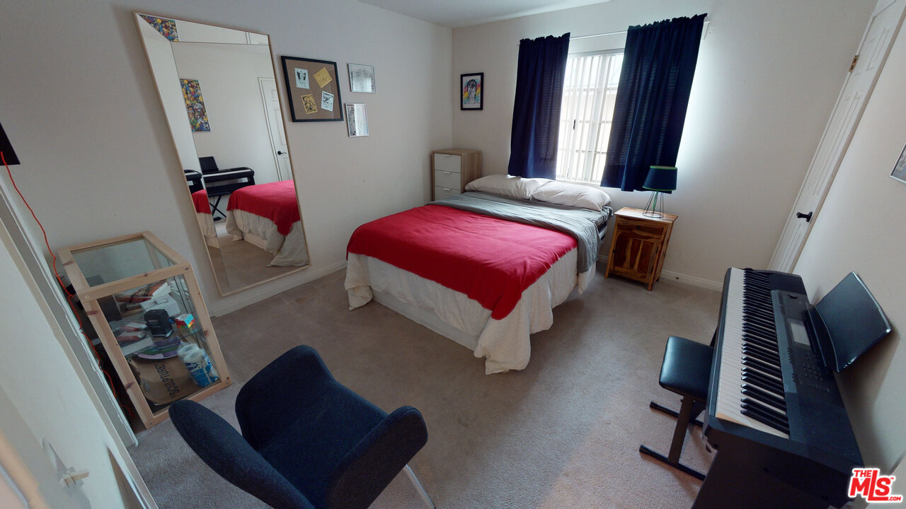 522 West Stocker Street, Unit 7 Glendale, CA 91202 - Photo 7 of 12 a bedroom with a bed window and dresser