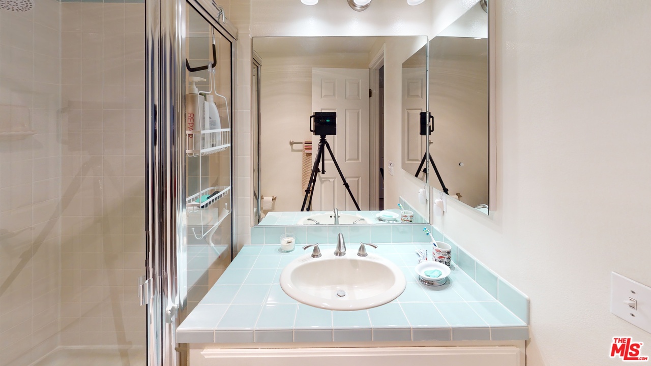522 West Stocker Street, Unit 7 Glendale, CA 91202 - Photo 8 of 12 a bathroom with a sink vanity and a mirror