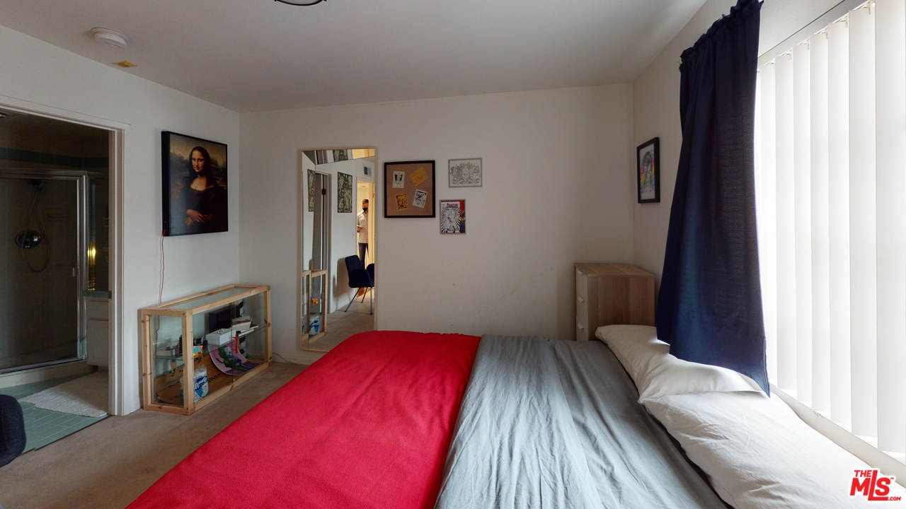 522 West Stocker Street, Unit 7 Glendale, CA 91202 - Photo 9 of 12 a bedroom with a bed and a flat tv screen on dresser