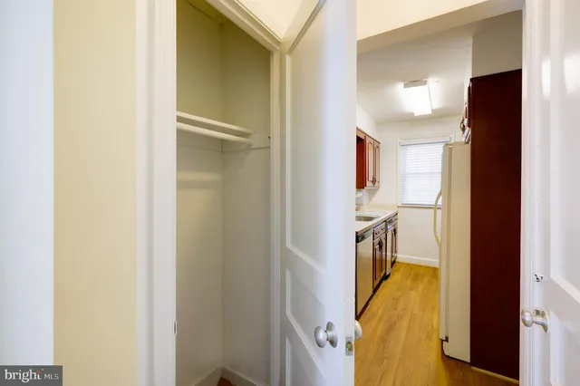 a view of a walk in closet and bathroom