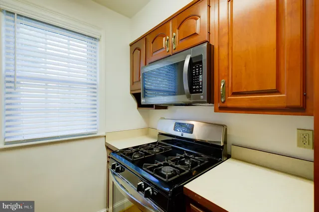 a kitchen with a stove and a microwave