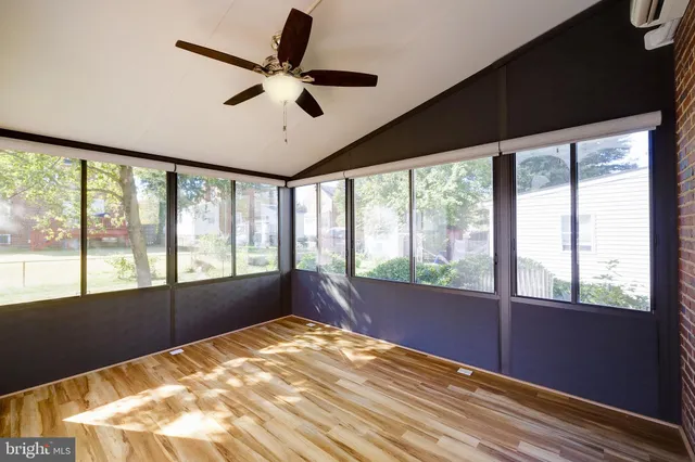 a view of an empty room with a large window