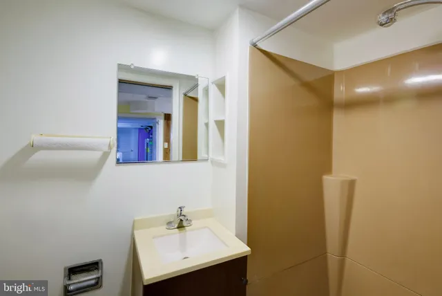 a bathroom with a sink and a mirror