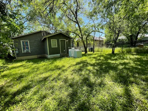 a view of a house with a yard porch and sitting area
