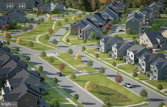an aerial view of a house with a big yard
