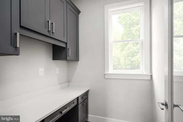 a room with cabinets and a window