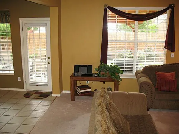 a living room with furniture and a window