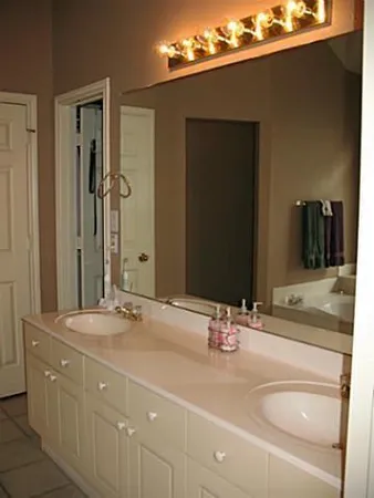 a bathroom with a sink and a mirror