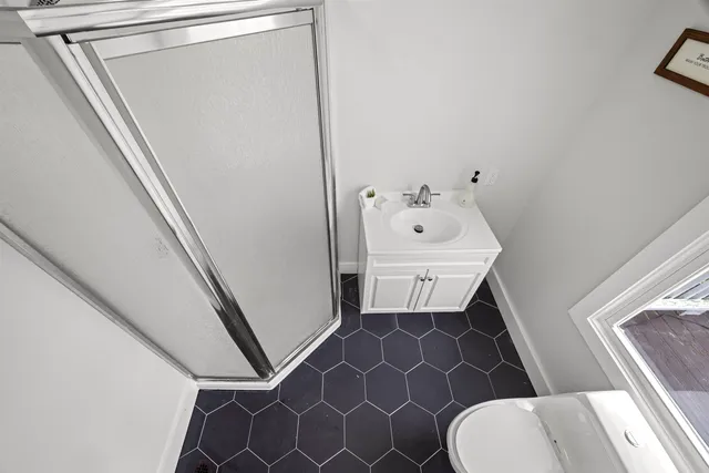 a bathroom with a sink and toilet