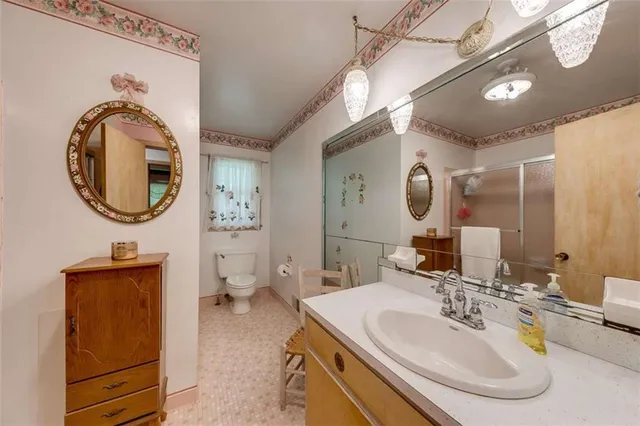 a backyard of a house with a garden and deck