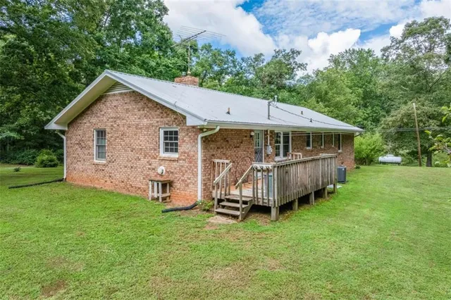 a view of a house with a yard and garage