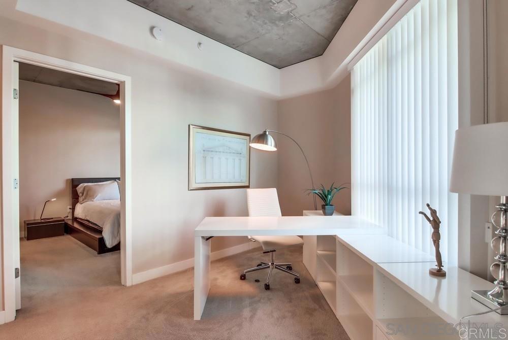 801 Ash Street, Unit 205 San Diego, CA 92101 - Photo 11 of 25 a living room with furniture and a table