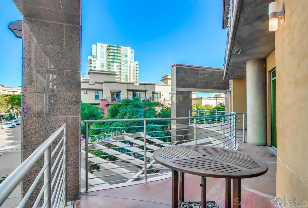 801 Ash Street, Unit 205 San Diego, CA 92101 - Photo 16 of 25 a view of a chair and tables in the balcony