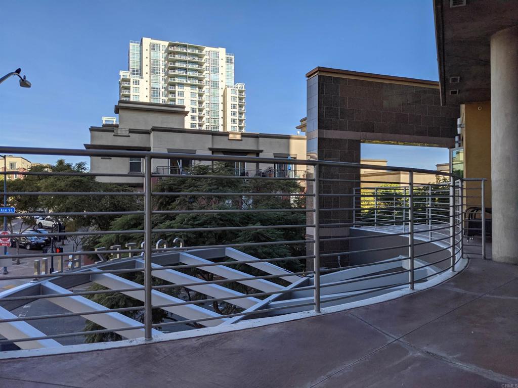 801 Ash Street, Unit 205 San Diego, CA 92101 - Photo 20 of 25 a room with wooden cabinets and an empty room
