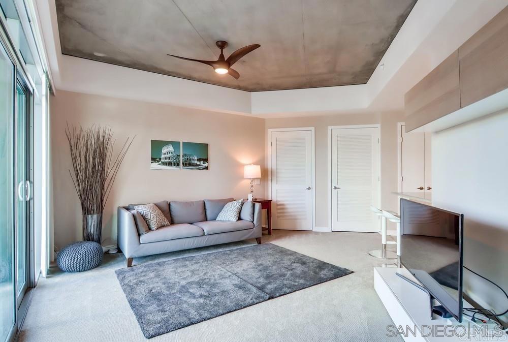 801 Ash Street, Unit 205 San Diego, CA 92101 - Photo 9 of 25 a living room with furniture and a rug