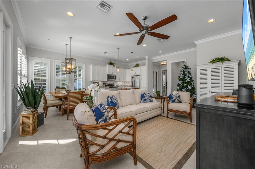 6552 Dominica Drive, Unit 101 Naples, FL 34113 - Photo 3 of 50 a living room with furniture kitchen view and a large window