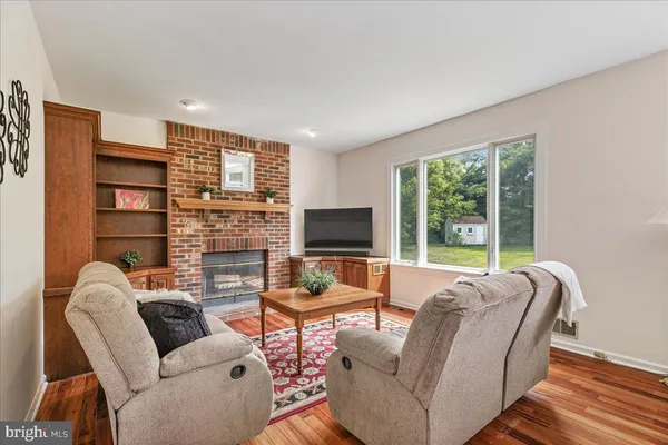 a living room with furniture or couch and a flat screen tv