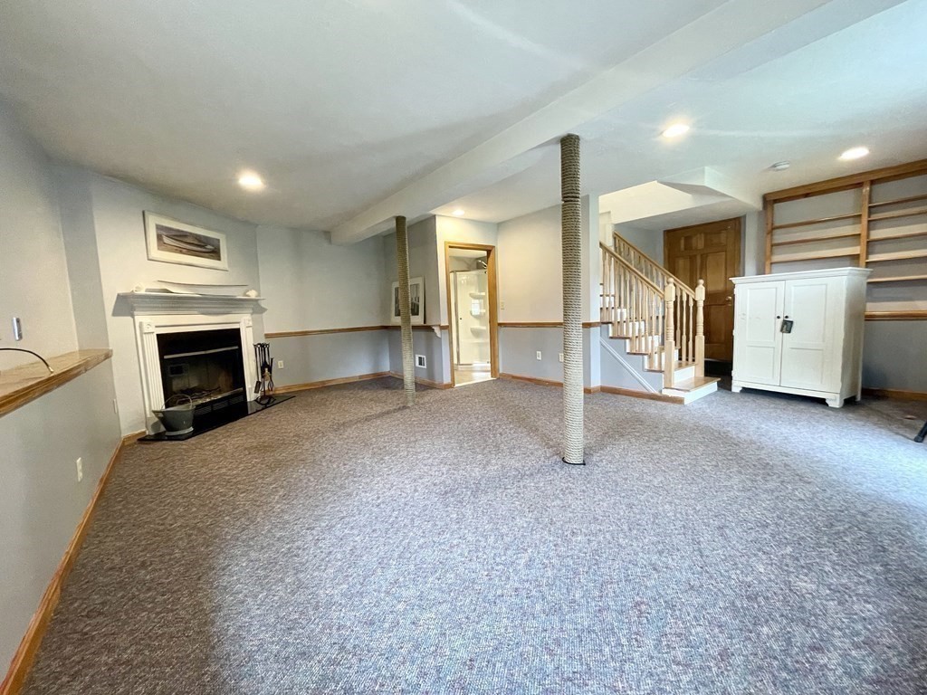 67 Colonial Road Weymouth, MA 02191 - Photo 21 of 31 a view of a livingroom with furniture and a fireplace
